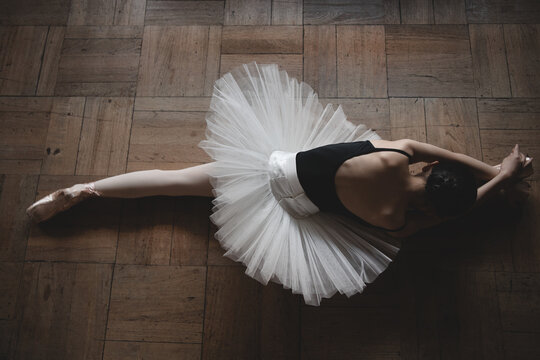 ballerina stretching on the floor 