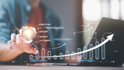 Businessman showing business growth and success graph ,concept of progress in development ,...