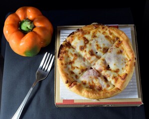 pizza with pepper and cheese