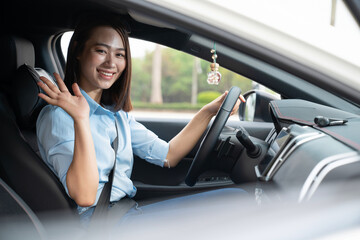 Young Asian woman with car