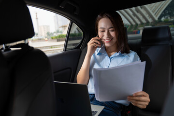 Young Asian woman with car