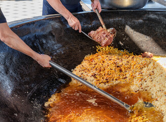 Uzbek plov is being prepared in giant kazan, Tashkent