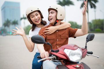 Young Asian couple on the motorbike © Timeimage