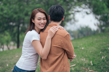 Fototapeta premium Photo of young Asian couple outside