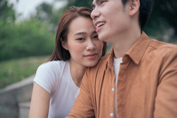 Fototapeta premium Photo of young Asian couple outside