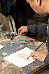 Fototapeta na wymiar Precision and Patience: Artisan Blacksmith measuring Metal Rod for Art Piece