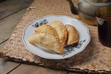 Traditional Curry Puff or Malay people called Karipap filled with potato filling