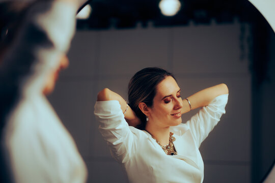 Happy Woman Putting On A Beautiful Statement Necklace. Pretty Elegant Lady Wearing Turkish Style Accessory 
