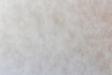 photo of beige leather texture faded by exposure to the sun until it is colorless