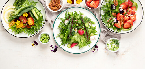 Fototapeta na wymiar Various of spring vegetable salads. Tasty healthy food.