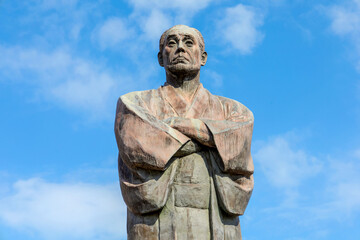 Nakatsu, Japan - Nov 26 2022: The statue of Fukuzawa Yukichi at Nakatsu station. He's an important person in Japanese History, educator, philosopher, writer, and samurai who founded Keio University - 603201152