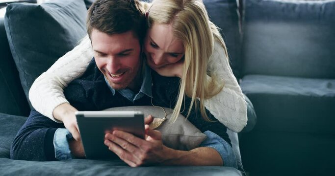 Love, hug or couple on tablet in living room home for online shopping, internet news research or content. Care, bonding or man and woman on tech for networking, reading blog or social media search