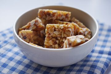 peanuts sweet candy in a bowl on table 