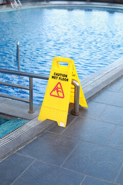 wet floor sign in the pool