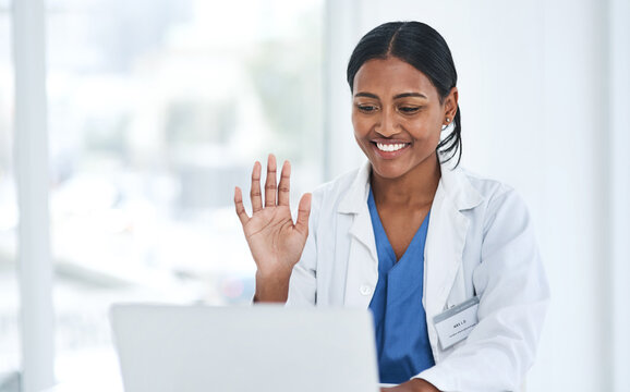 Hand, hello and woman doctor on laptop video call for online consulting, help and advice in a hospital. Telehealth, hi and female healthcare expert on virtual consult or medical conference on space