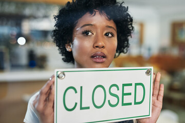Sad woman, face and closed sign on window at cafe in small business, bankruptcy or fail. Female person or waitress holding billboard in store debt, financial crisis or out of service and closing shop