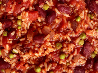 Vegan chili or vegetarian tomato bean risotto as a plant based rustic meal with rice tomatoes and kidney beans as an organic cuisine.