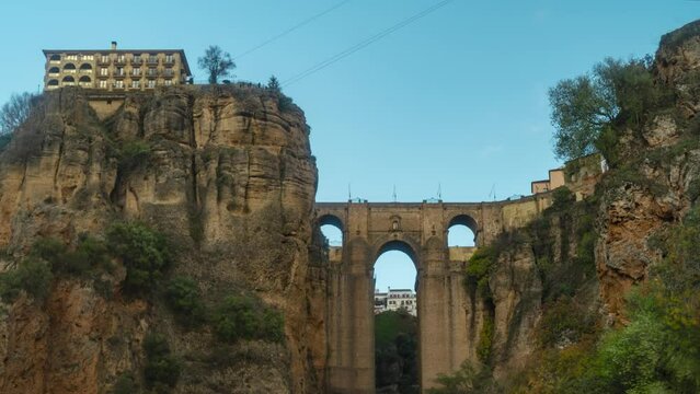 Medieval bridge and buildings of Ronda town, time lapse view