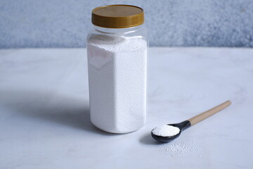 Detergent powder against white background 