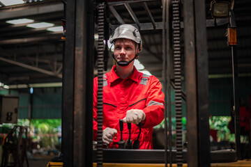 Portrait worker industry factory wear safety uniform factory drive  forklift truck to control goods production work plantation is factory transportation.
