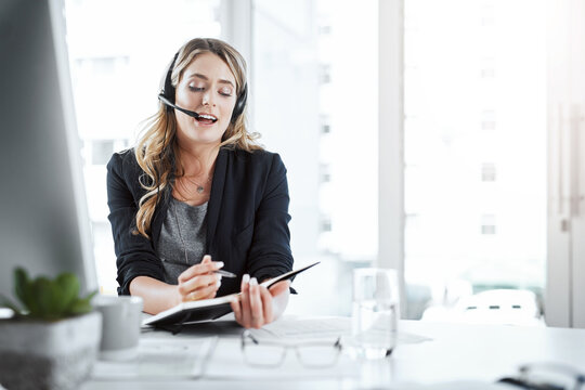 Secretary, receptionist and woman writing notes in the office planning company schedule. Call center, telemarketing and female customer support agent working on crm strategy with desktop in workplace