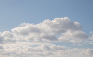 Naklejka na ściany i meble White clouds against the blue sky. Cloudy sky background.