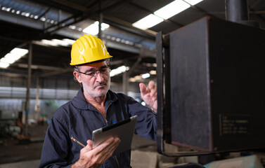 Senior technicians inspect and repair mechanical systems in machine control cabinets. in order for the machine to return to normal operation
