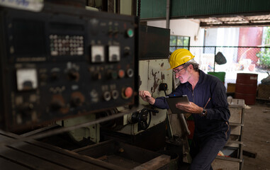 Senior technicians inspect and repair mechanical systems in machine control cabinets. in order for the machine to return to normal operation