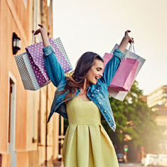 Excited, happy and woman with bags from shopping, retail therapy and sale in the city. Smile,...