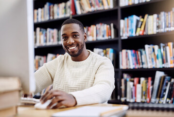 Portrait, smile and black man in a library, computer and search website for information, research and knowledge. Face, male person and student with technology, internet and university for education