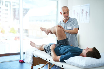 Physical therapist, client and man with leg injury, healing and consultation for rehabilitation....