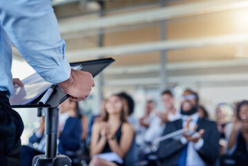 Closeup, presentation and speaker with crowd, applause or speech with workshop, seminar or...