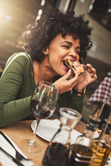 Relax, girl and woman with pizza, restaurant and red wine on a weekend break, delicious and celebration. Female person, eating and lady with food, alcohol and drinking for event, party and hungry