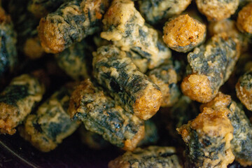 Various kinds of delicious-looking tempura fried in high-temperature oil