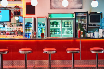 Retro, vintage and stools with interior in a diner, restaurant or cafeteria with funky decor....