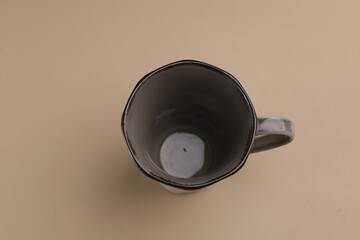 Empty cup, single product, isolated on beige background