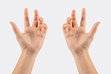 Hand of woman showing thumb-up gesture on white background