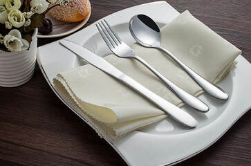 Stainless steel tableware and kitchen utensils placed on the desktop