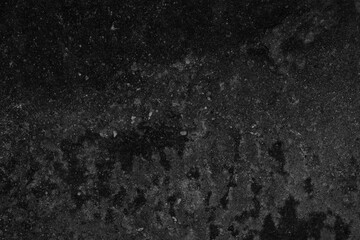 Black concrete or cement material in abstract wall background texture.