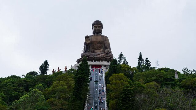 4K Time lapse Tiantan Buddha or Big Buddha in Hong Kong. Closeup group of pople are walking up the stairs to the Buddha to pay their respects. Pray for faith.