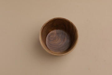 Empty wooden bowl or saucer, isolated, copy space