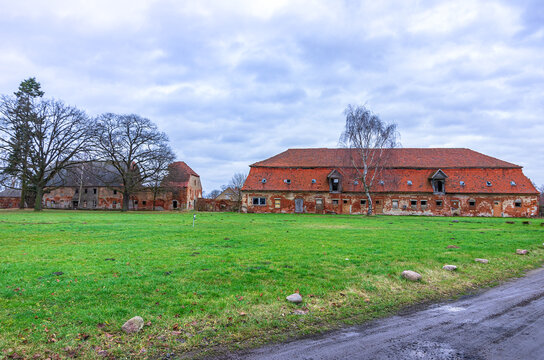 Dilipidated outbuilding and barns of a disintegrated baroque manor, Kummerow Manor, Mecklenburg Pomerania, Germany. 