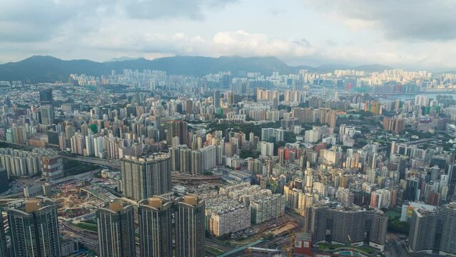 4K Time lapse Panoramic view of Hong Kong City before sunset or sunrise. View of financial district high-rise and residential buildings during sunset or sunrise time from view point Observation.