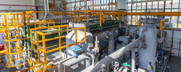 Power electric gas factory plant with yellow pipelines and reed valves