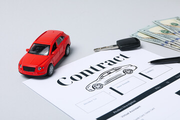 Concept of car purchase and insurance with toy car