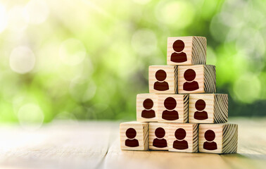 Building a strong team, Wooden blocks with people icon, Human resources and management concept....