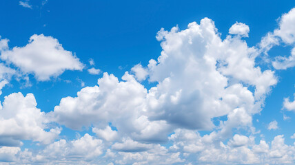 Obraz na płótnie Canvas Blue sky filled with fluffy white clouds.