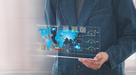 Businessman using a transparent tablet digital to business finance data analytics graph KPI dashboard on virtual screen. Business Project management system. .