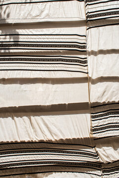 Sukkah wall made from Jewish prayer shawls