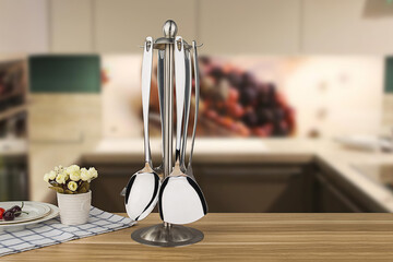 Stainless steel tableware and kitchen utensils placed on the desktop